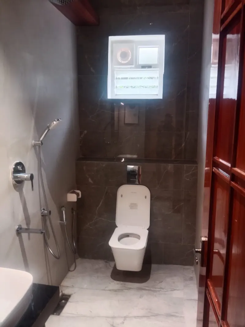 Attached bathroom with rain shower and 24-hour hot water at Sai Grand Resorts, Kumbakarai